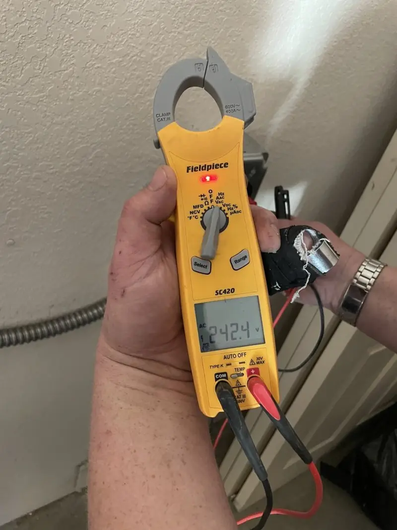 Voltage testing with clamp meter during Generator Installation in Richmond West